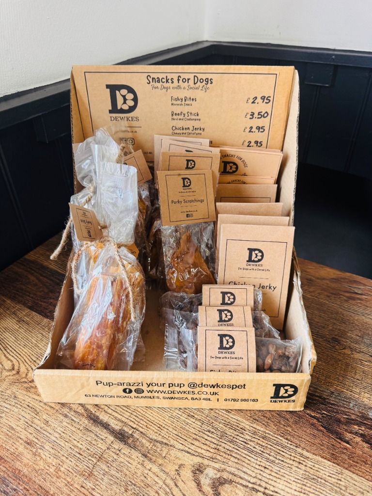 A display of packaged dog treats at Coast Cafe.